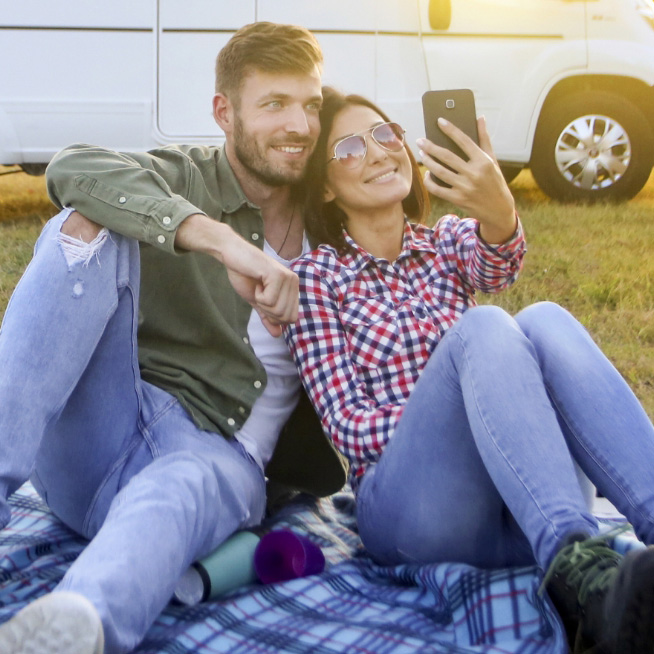 couple taking selfie on their first motorhome trip